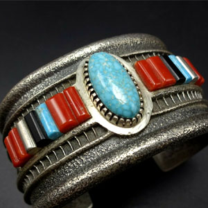 Navajo artist Jim Harrison made coral cuff bangle